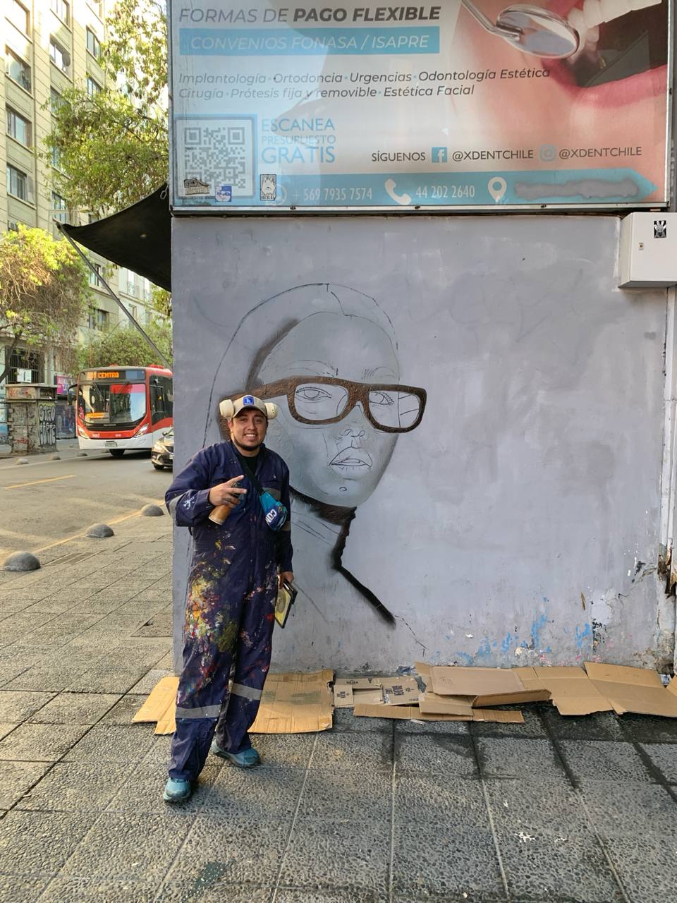 Final documentation photo of the completed mural and surrounding street context in Santiago